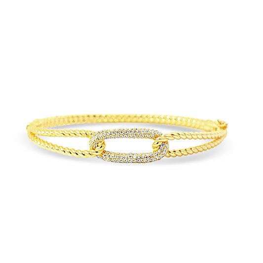 Sterling silver ribbed gold intertwined bangle with cz pave oval in center