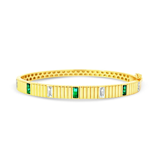 Sterling silver bezel set emerald and green emerald bangle in yellow gold