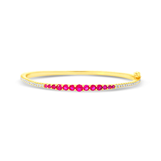 Sterling silver graduated tennis bangle with ruby center